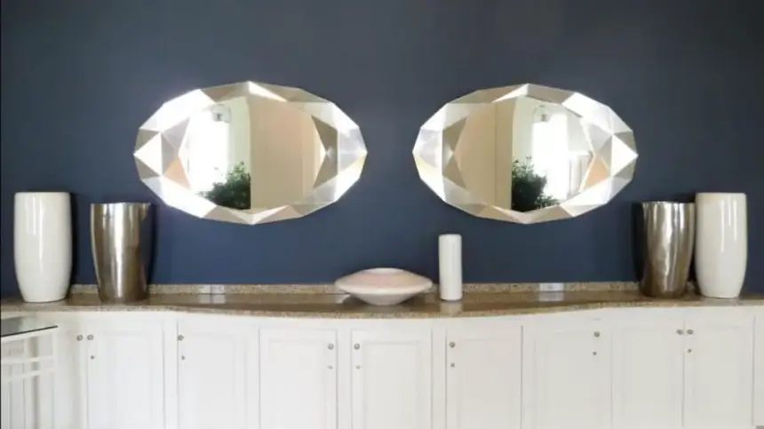 Mirror and vases arranged symmetrically.