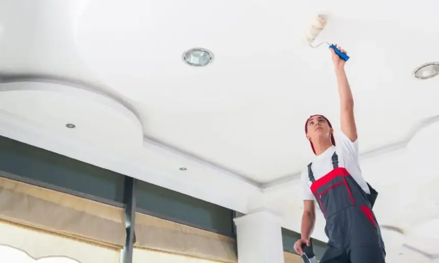 Painting the ceiling.