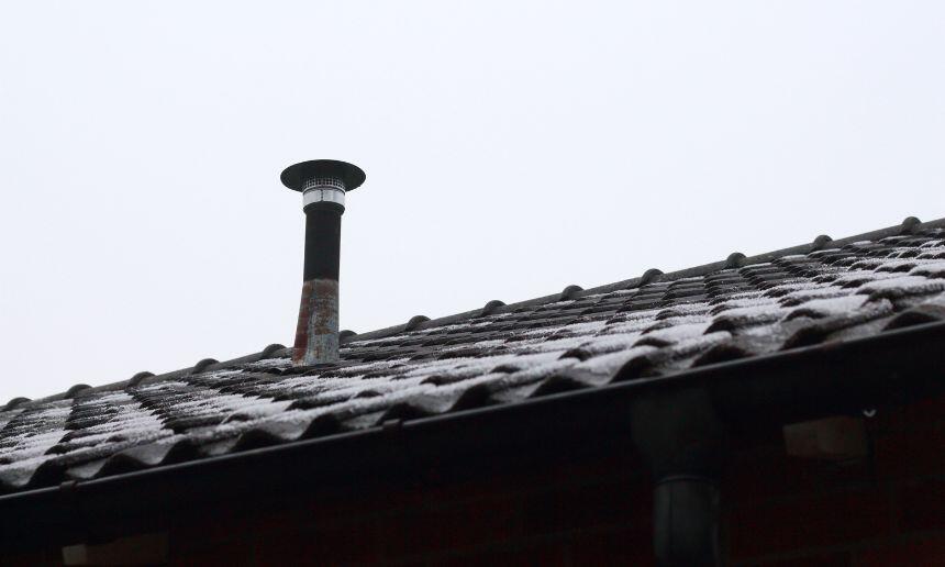 Roof vent pipe with cover.