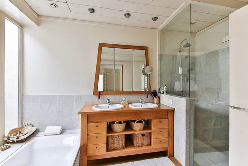 Bathroom with wood furnniture.