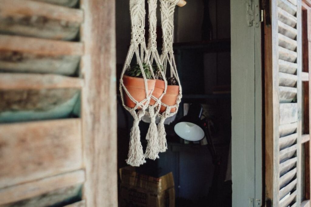 Plant hanger with three flower pots.